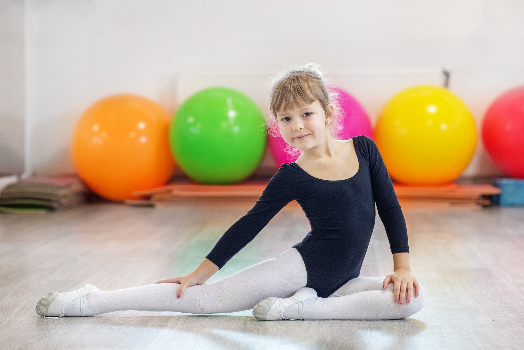 Small kid is engaged in gymnastics in training. Concept of sports, education, hobbies, training